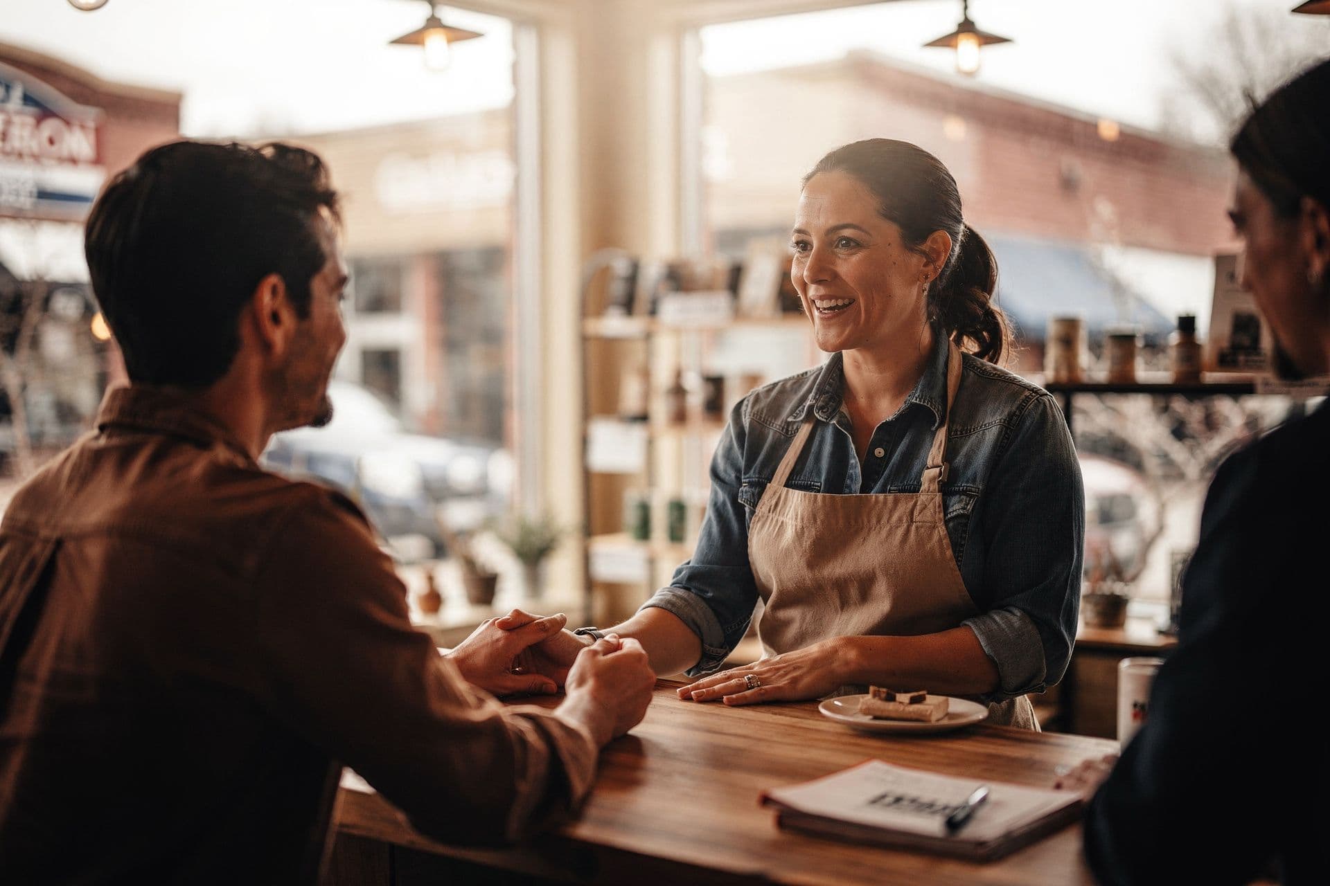 Colorado small business owner woman engaging with customers