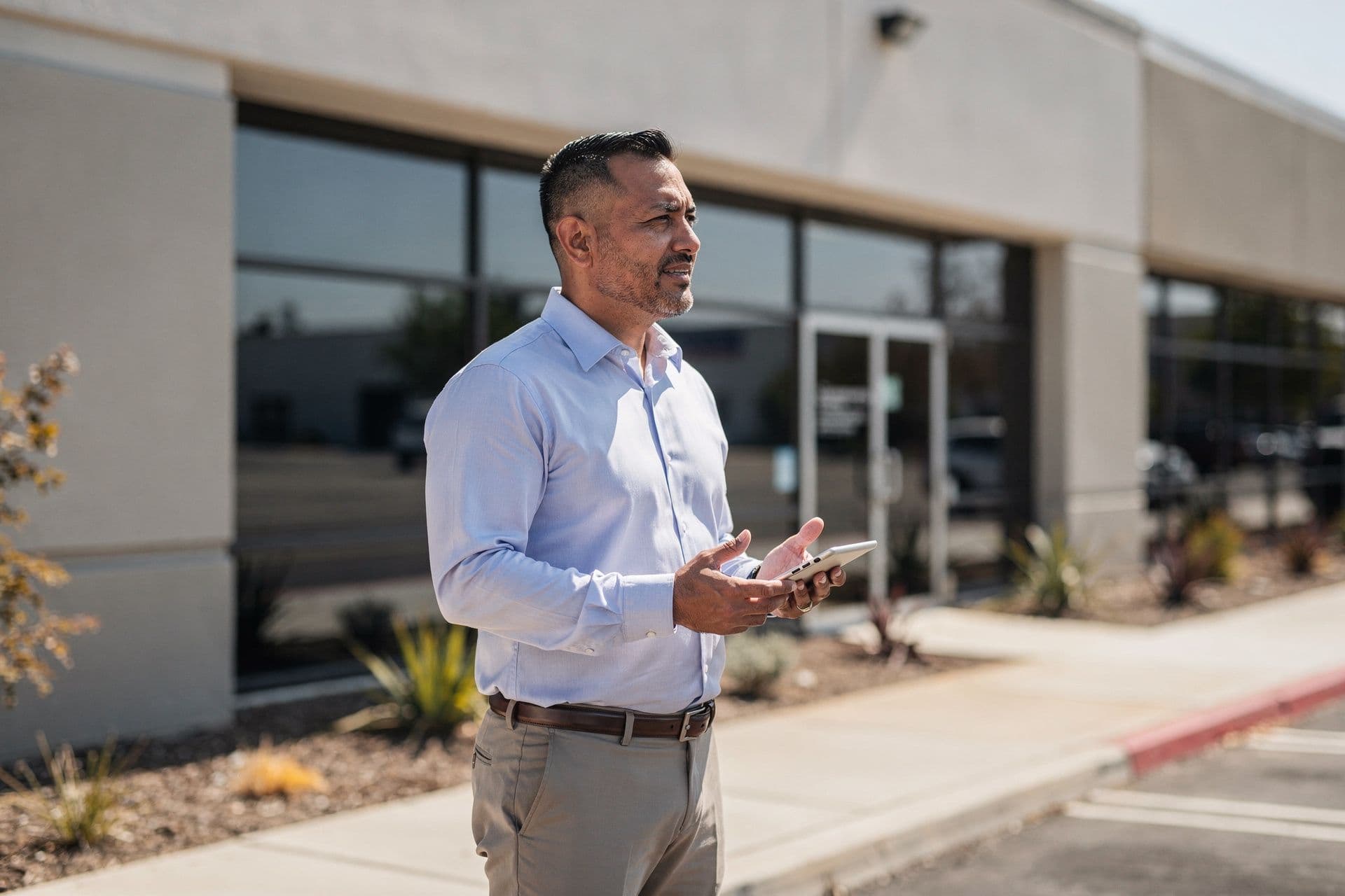 Carlos Flores, Chief Executive Officer & Principal Broker of SunValley Properties Inc a real-estate business in Central California standing with a calm, assured presence