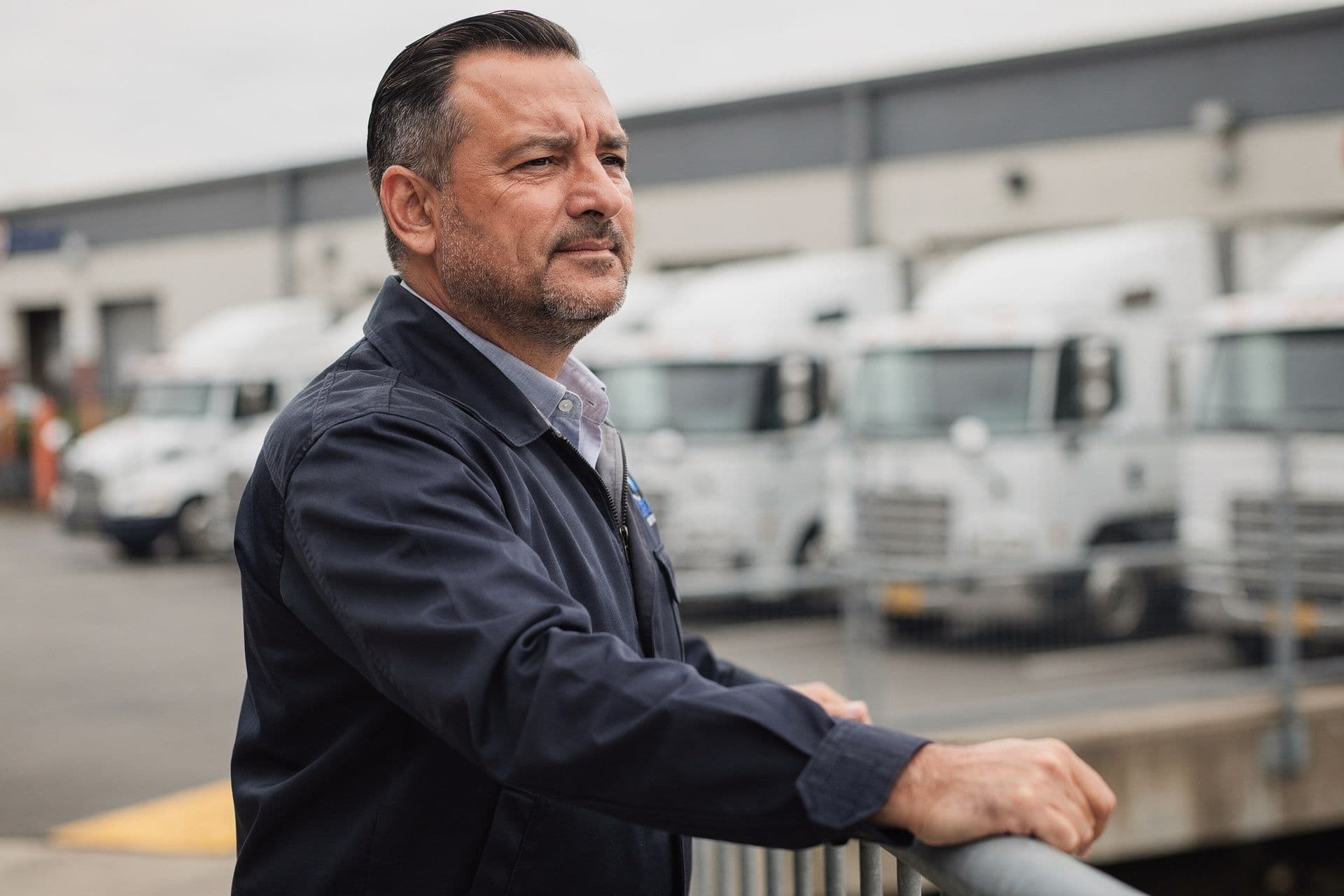 Henry Kowalski, Fleet Operations Director of Northeast Logistics Solutions a trucking business in New York standing confidently