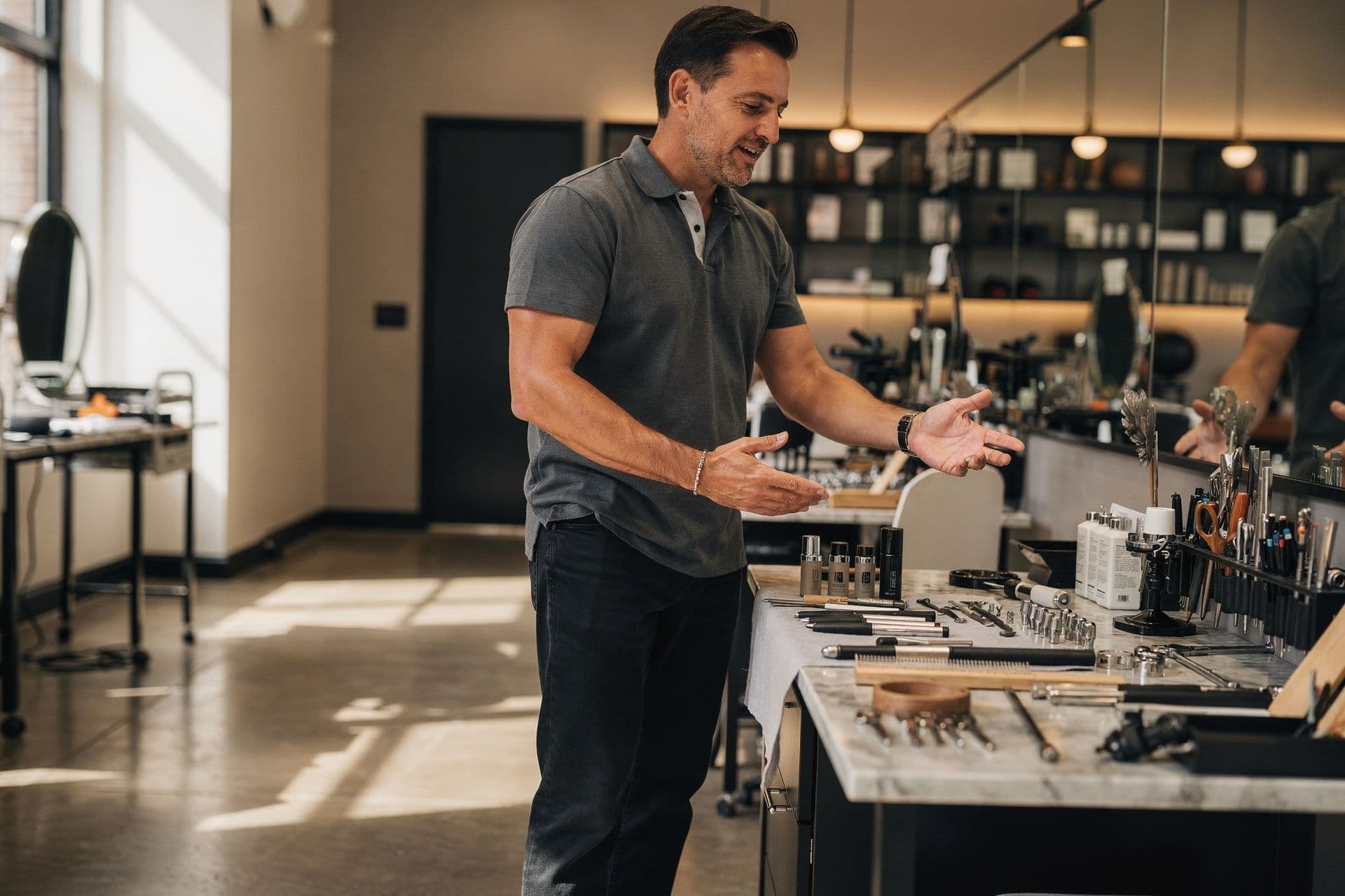 Kevin Patterson, Owner and Creative Director of Elite Salon Group a personal-services business in New York standing naturally