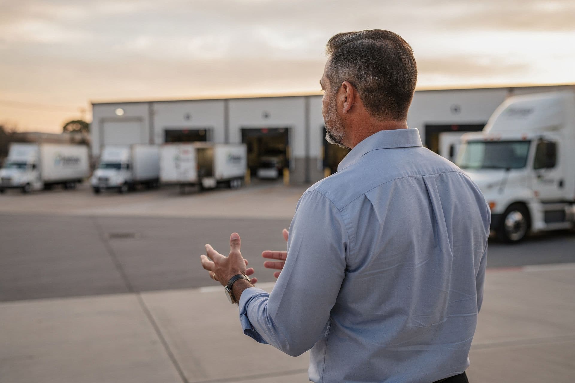 Marcus J. Hendricks, President and Founder of FlexRoute Transportation Solutions a transportation business in Dallas, Texas standing proudly