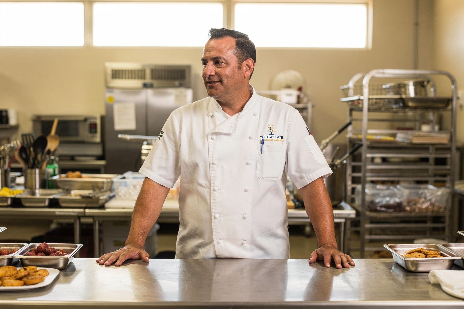 Xavier Alvarez, Executive Chef and Founder of Yellow Plate Catering a food-services business in Southern California standing with a relaxed, confident posture